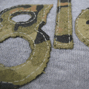 This is a screenprint, not sewn. Special effect using High Density Inks