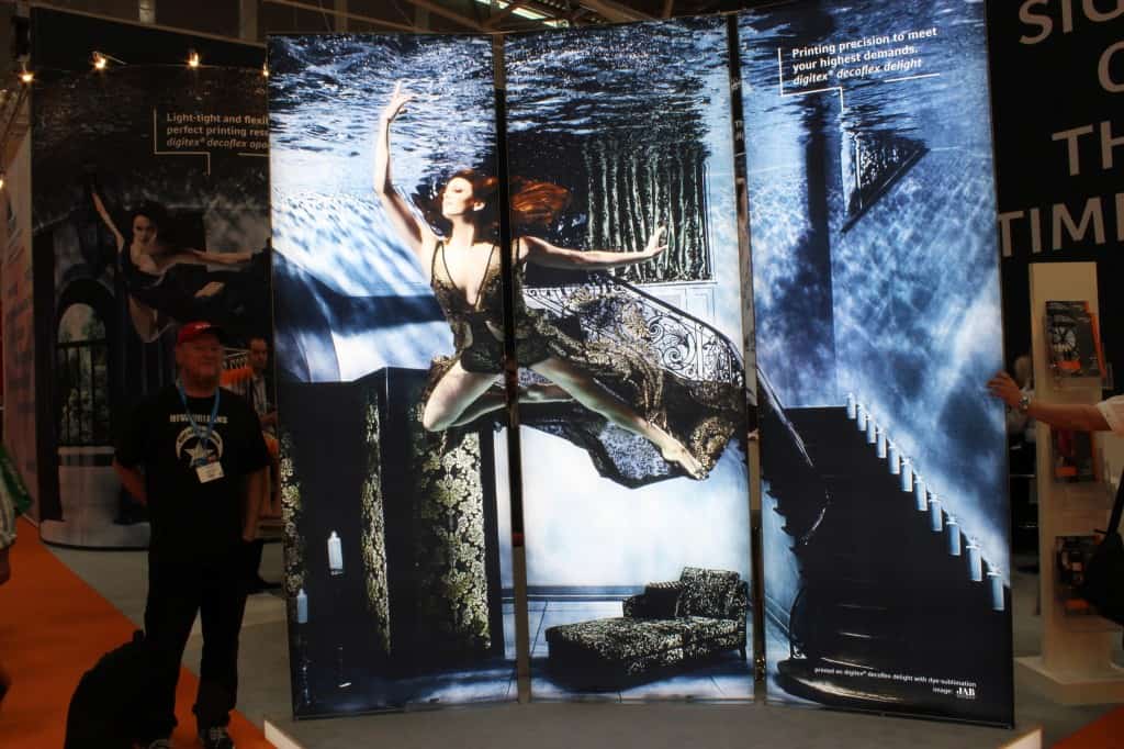 Striking image in a booth selling substrates for sublimation for signs.