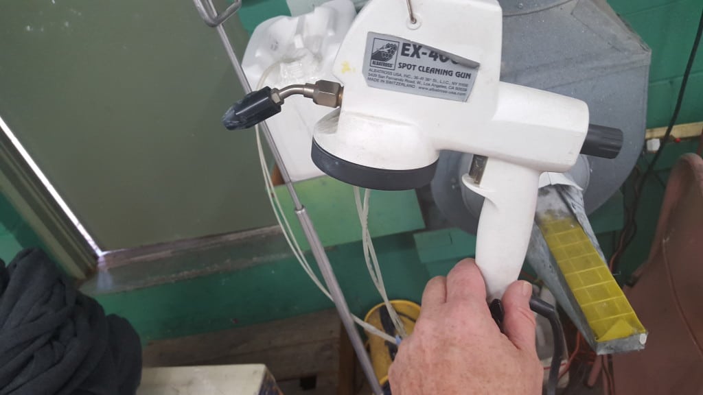 Here is an Albatross spot cleaning "gun" which is on a tension cable and bulk fed. (which means you do less pouring which means less waste and less danger.)